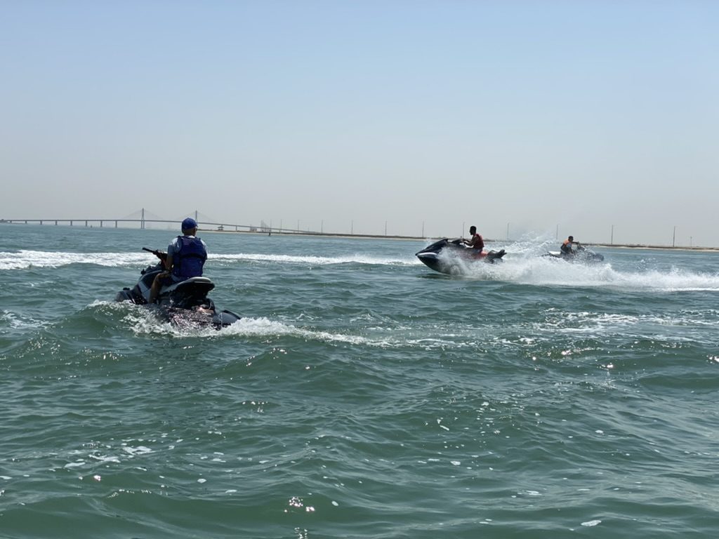 Group of riders on the water