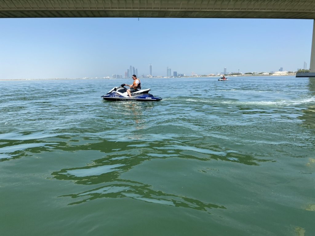 Rider passing under a bridge