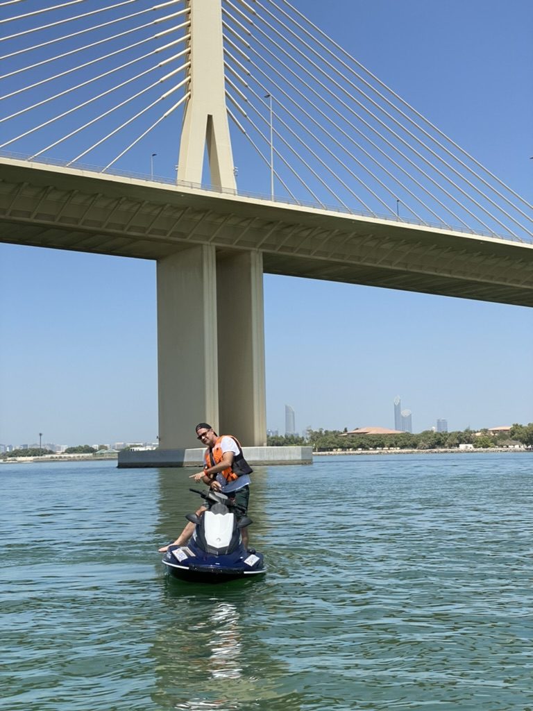 Rider beneath the bridge span heading for open water
